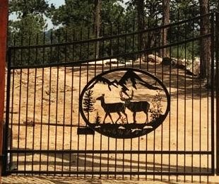 oval metal gate insert deer buck and doe mountains trees 